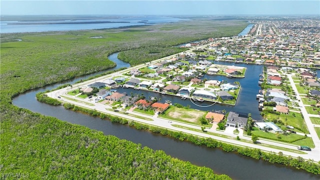 aerial view of residential area with a large body of water
