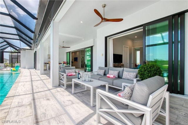 view of patio / terrace featuring ceiling fan, an outdoor hangout area, glass enclosure, and an outdoor pool