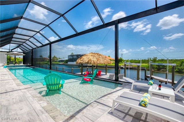 swimming pool featuring a water view, glass enclosure, a patio, and a boat dock