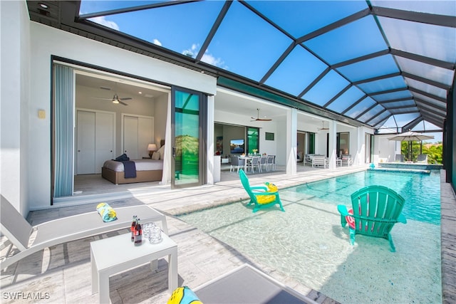 outdoor pool featuring a ceiling fan, a patio, an outdoor living space, and glass enclosure