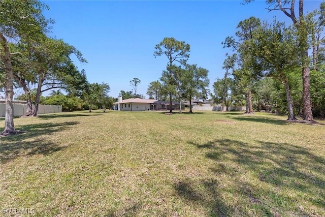 view of yard with fence