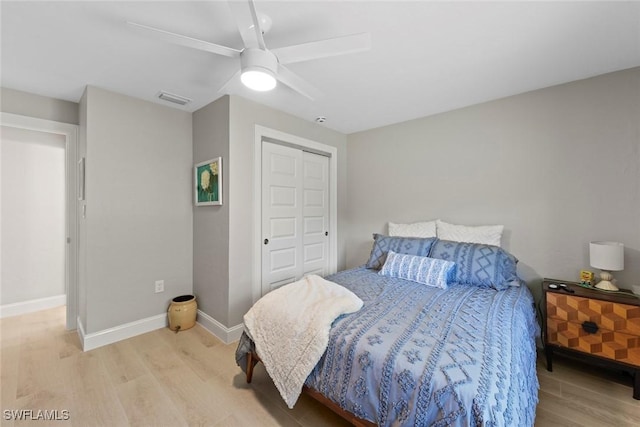 3795 Liberty Sq, Fort Myers, FL 33908 - bedroom with light wood-style flooring, a closet, ceiling fan, and baseboards