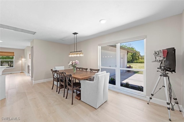 3795 Liberty Sq, Fort Myers, FL 33908 - dining room featuring light wood-style flooring, baseboards, and plenty of natural light