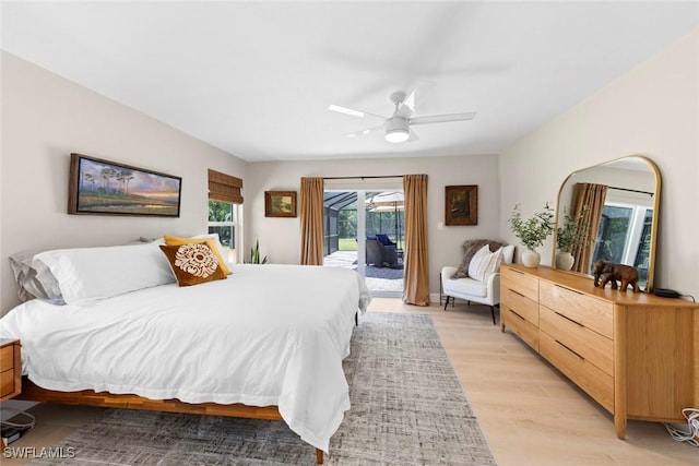 bedroom with ceiling fan, light wood-style flooring, and access to exterior
