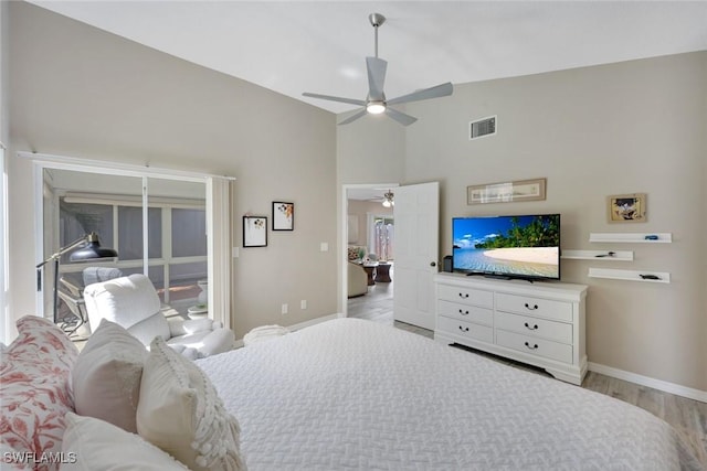 14871 Crescent Cove Dr, Fort Myers, FL 33908 - bedroom with visible vents, baseboards, ceiling fan, high vaulted ceiling, and light wood-style flooring