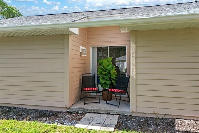 14871 Crescent Cove Dr, Fort Myers, FL 33908 - property entrance with a shingled roof