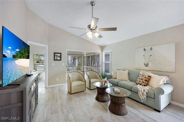 14871 Crescent Cove Dr, Fort Myers, FL 33908 - living area featuring baseboards, light wood-style floors, ceiling fan, and high vaulted ceiling