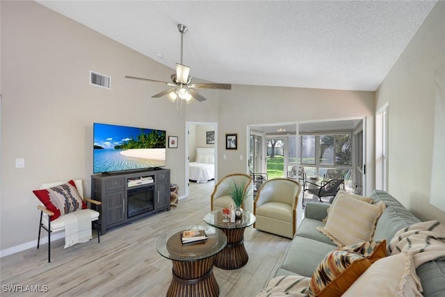 14871 Crescent Cove Dr, Fort Myers, FL 33908 - living room featuring visible vents, light wood-style floors, baseboards, high vaulted ceiling, and a ceiling fan