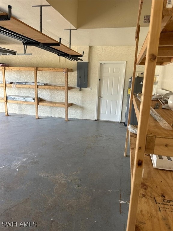 garage with water heater and electric panel