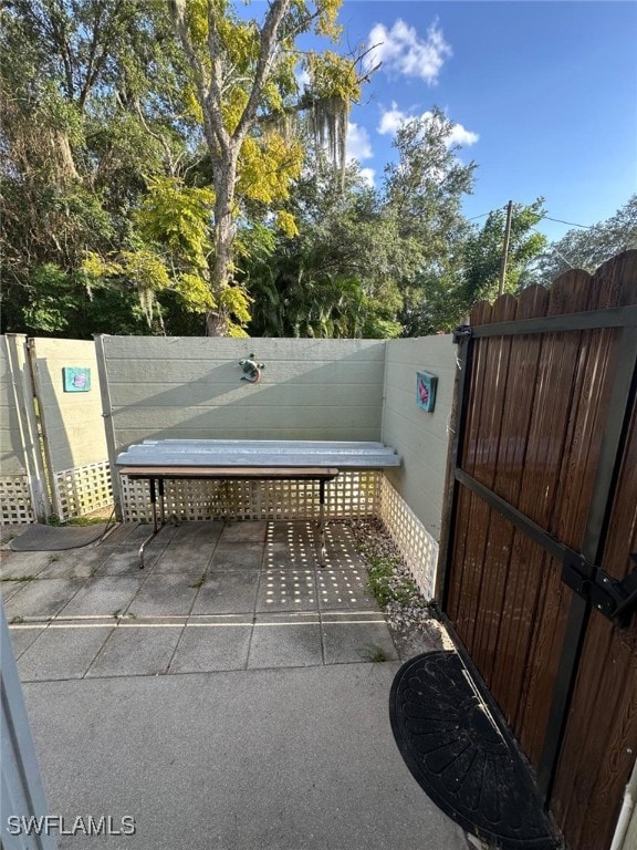 view of patio / terrace featuring fence