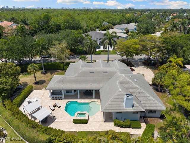 view from above of property featuring a pool area