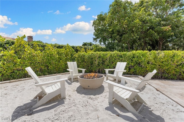 view of patio / terrace featuring an outdoor fire pit