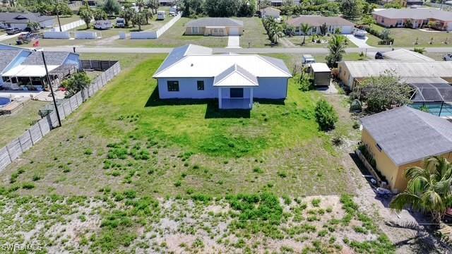 309 Fifth Ave, Lehigh Acres, FL 33936 - aerial perspective of suburban area