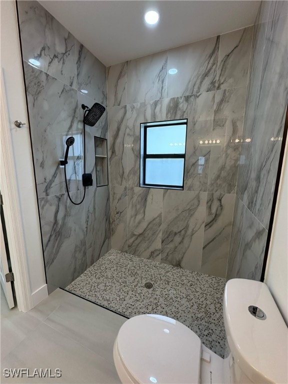 full bathroom with toilet, recessed lighting, and a marble finish shower
