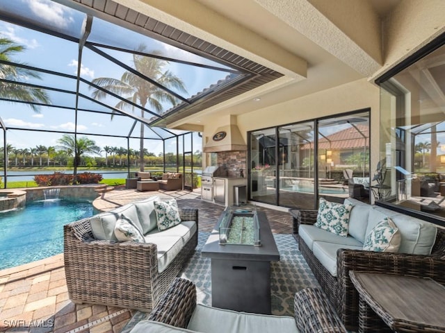 view of patio with glass enclosure, area for grilling, a water view, and an outdoor living space with a fire pit
