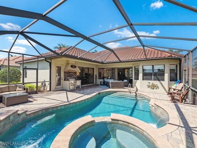 view of swimming pool featuring outdoor lounge area, area for grilling, a pool with connected hot tub, and a patio area