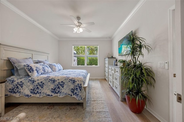 20005 Parrot Key Ct, Estero, FL 33928 - bedroom with light wood-style flooring, baseboards, ornamental molding, and a ceiling fan