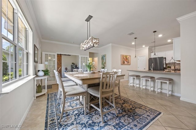 20005 Parrot Key Ct, Estero, FL 33928 - dining area with baseboards, visible vents, ornamental molding, and light tile patterned flooring