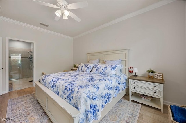 20005 Parrot Key Ct, Estero, FL 33928 - bedroom with light wood finished floors, visible vents, ensuite bath, crown molding, and ceiling fan