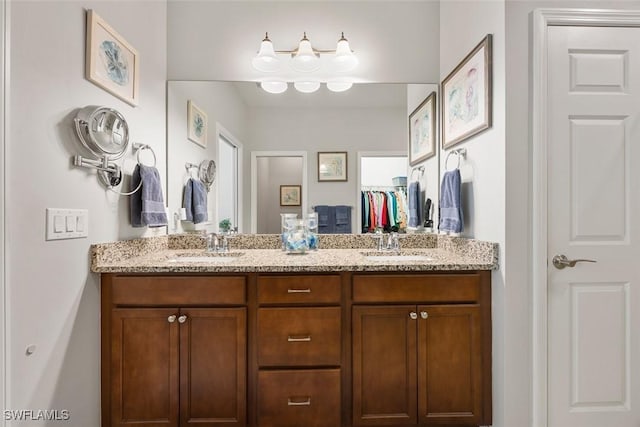 20005 Parrot Key Ct, Estero, FL 33928 - bathroom with double vanity, a closet, and a sink