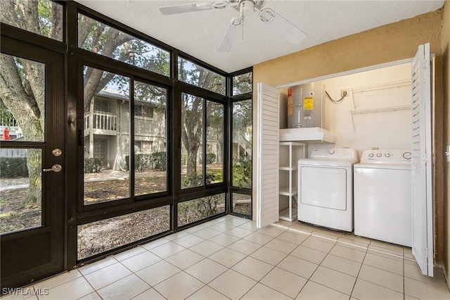 5731 Foxlake Dr Unit 1, North Fort Myers, FL 33917 - washroom with washing machine and clothes dryer, tile patterned floors, laundry area, a ceiling fan, and electric water heater
