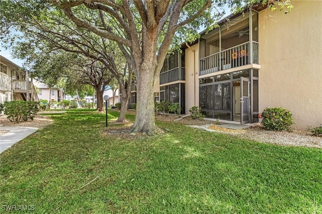 5731 Foxlake Dr Unit 1, North Fort Myers, FL 33917 - view of home's community featuring a lawn