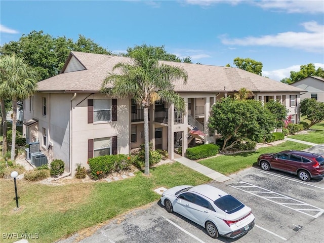 5731 Foxlake Dr Unit 1, North Fort Myers, FL 33917 - view of building exterior with uncovered parking