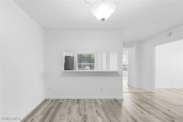 5731 Foxlake Dr Unit 1, North Fort Myers, FL 33917 - unfurnished room featuring wood finished floors and baseboards