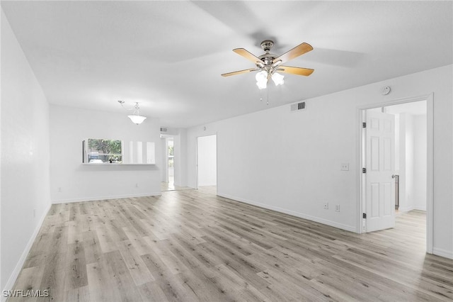 5731 Foxlake Dr Unit 1, North Fort Myers, FL 33917 - unfurnished living room featuring visible vents, a ceiling fan, light wood finished floors, and baseboards