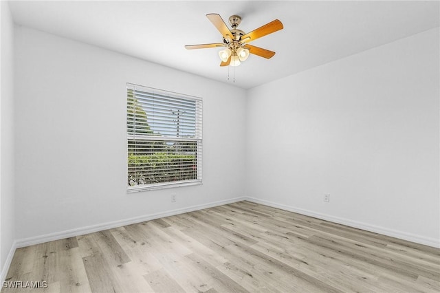 5731 Foxlake Dr Unit 1, North Fort Myers, FL 33917 - empty room with wood finished floors, a ceiling fan, and baseboards