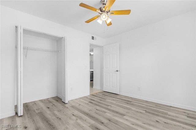 5731 Foxlake Dr Unit 1, North Fort Myers, FL 33917 - unfurnished bedroom with a closet, a ceiling fan, visible vents, baseboards, and wood finished floors