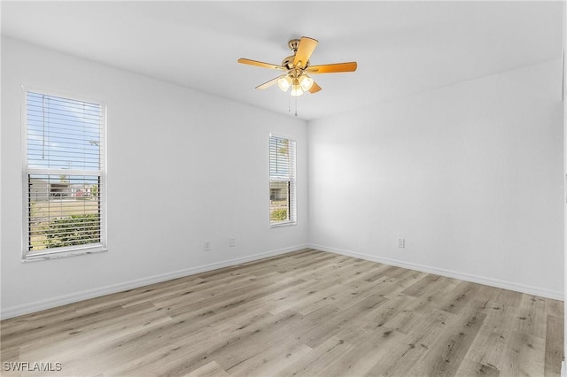 5731 Foxlake Dr Unit 1, North Fort Myers, FL 33917 - spare room with a ceiling fan, light wood finished floors, and baseboards