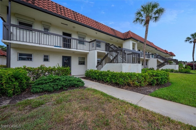 view of property featuring stairs