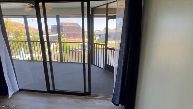 1521 SW 47th Ter Unit 204, Cape Coral, FL 33914 - doorway to outside featuring concrete flooring and a wealth of natural light