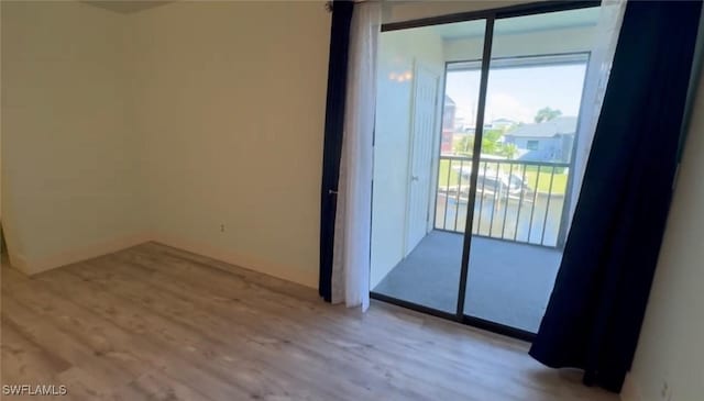 1521 SW 47th Ter Unit 204, Cape Coral, FL 33914 - empty room featuring wood finished floors and baseboards