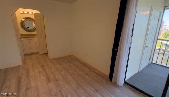 1521 SW 47th Ter Unit 204, Cape Coral, FL 33914 - interior space featuring arched walkways and wood finished floors