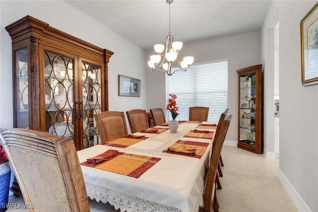 11692 Stonecreek Cir, Fort Myers, FL 33913 - dining space with a chandelier, light tile patterned floors, baseboards, and french doors