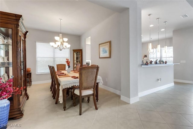 11692 Stonecreek Cir, Fort Myers, FL 33913 - dining area with a chandelier, light tile patterned floors, and baseboards