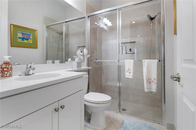11692 Stonecreek Cir, Fort Myers, FL 33913 - full bath featuring a shower stall, vanity, tile patterned floors, and toilet