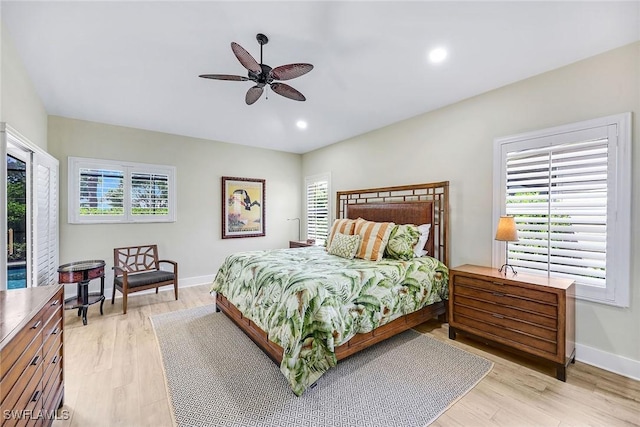 bedroom featuring baseboards, recessed lighting, a ceiling fan, and light wood finished floors