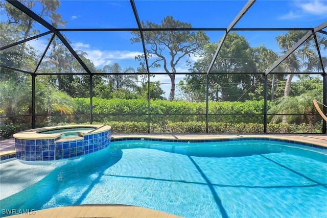 view of swimming pool featuring cooling unit, glass enclosure, and a pool with connected hot tub