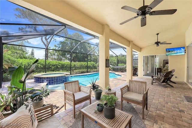view of patio / terrace featuring ceiling fan, glass enclosure, a pool with connected hot tub, and central air condition unit