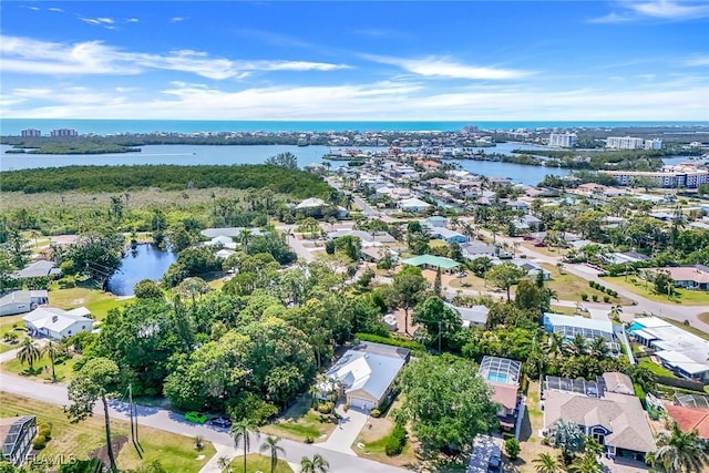 birds eye view of property with a residential view and a water view