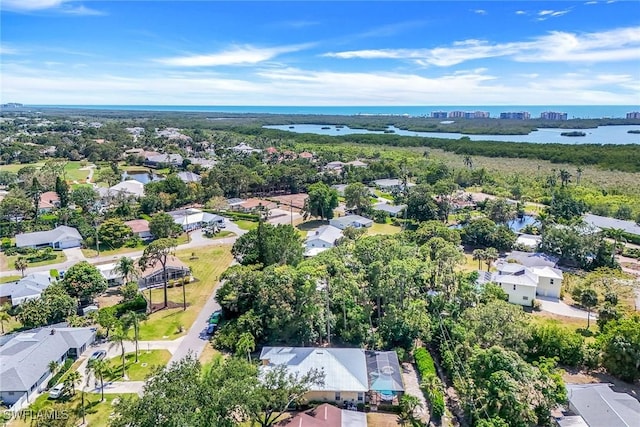 bird's eye view with a residential view and a water view