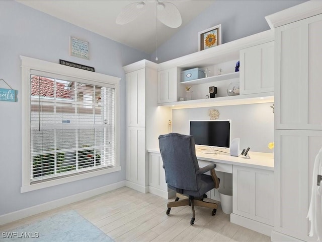 363 Pindo Palm Dr, Naples, FL 34104 - office featuring vaulted ceiling, built in desk, light wood finished floors, ceiling fan, and baseboards