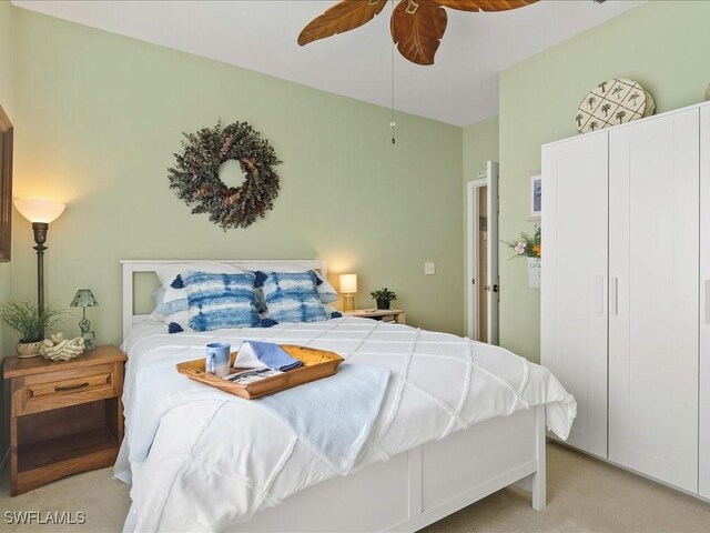 363 Pindo Palm Dr, Naples, FL 34104 - bedroom featuring light carpet and a ceiling fan