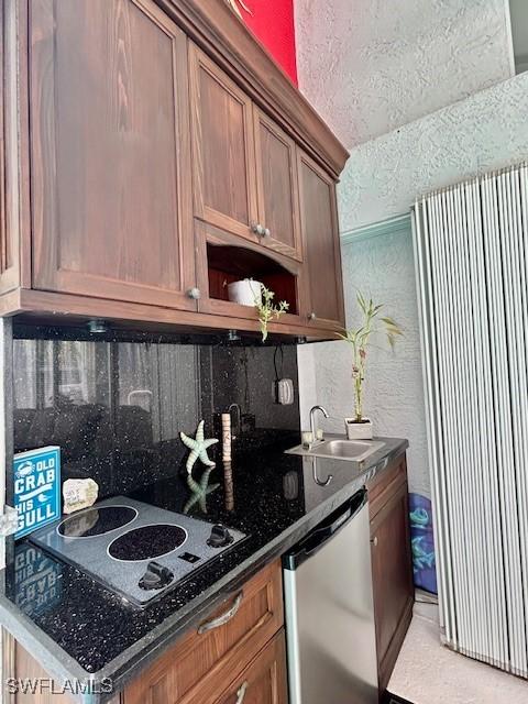 363 Pindo Palm Dr, Naples, FL 34104 - kitchen with stainless steel dishwasher, a sink, electric stovetop, and dark countertops