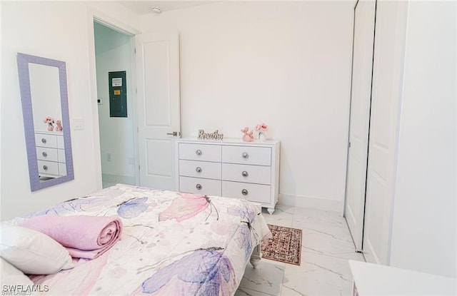 2404/2406 Mae Ave S, Lehigh Acres, FL 33973 - bedroom with light marble finish floors, electric panel, and baseboards