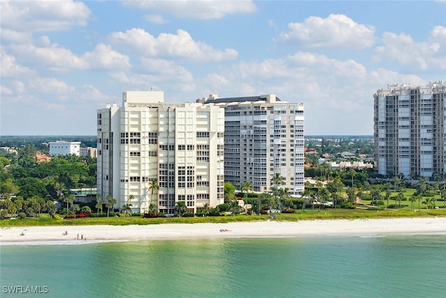 water view featuring a view of city and a beach view
