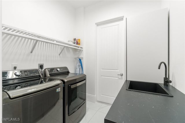 10191 Strike Ln, Bonita Springs, FL 34135 - washroom featuring a sink, laundry area, washing machine and dryer, and marble finish floor